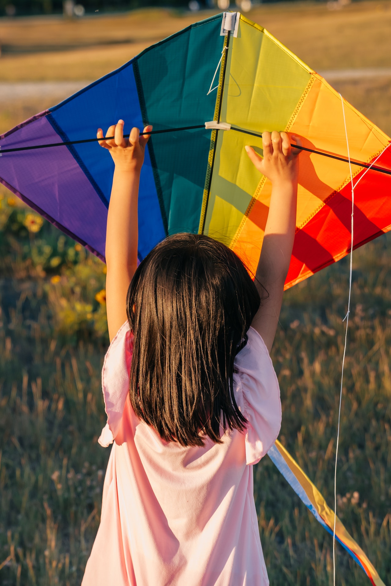 child holding kite